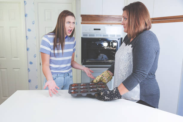 istock Teen and Parent Burnt Muffins Baking Fail 846636594