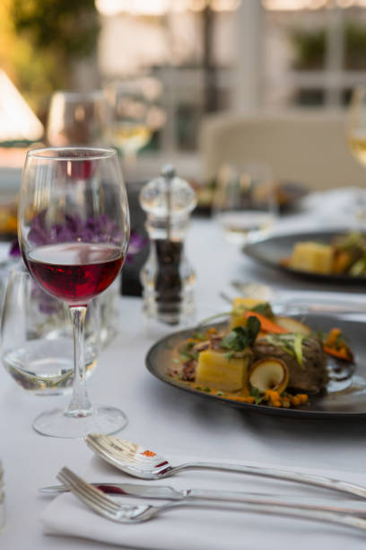 istock Red wine with food served on table 846636884