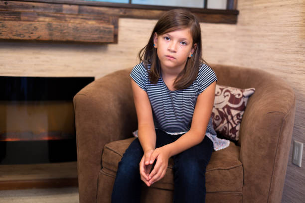 child expressing sad and somber emotions feeling alone and rejected for foster care photo shoot