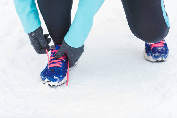 istock Tying sport shoes in snow 846643316