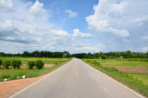 istock Asphalt road and cloud sky with green field 846643662