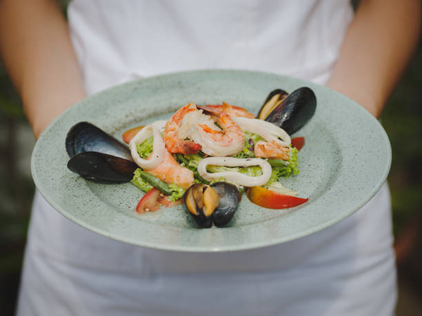 istock The fresh seafood dish in an expensive restaurant. Modern restaurant. Professional kitchen. Beautiful serving of food. 846646298