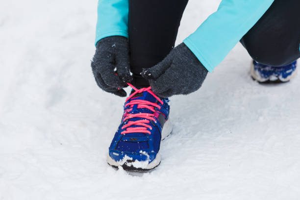 istock Tying sport shoes in snow 846649374