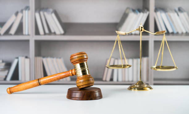 istock Law symbols on law books background 846649810