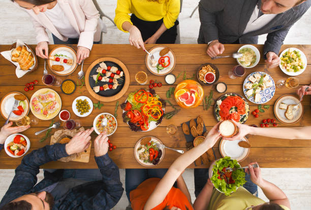 istock People eat healthy meals at served table dinner party 846651032