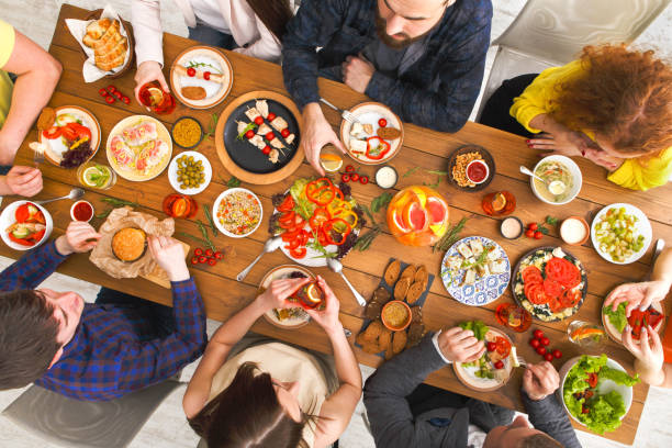 istock People eat healthy meals at served table dinner party 846653128