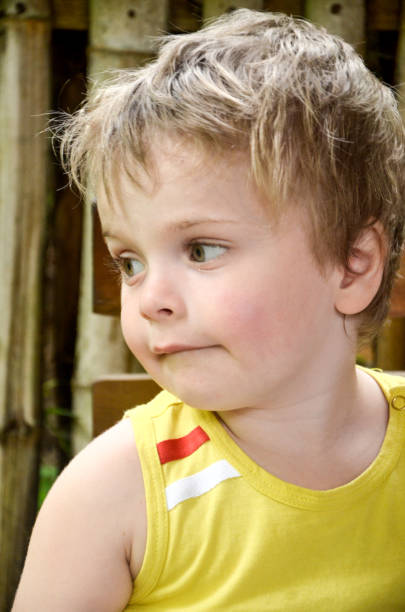 istock Boy 3 years old, blond in yellow T-shirt 846653188