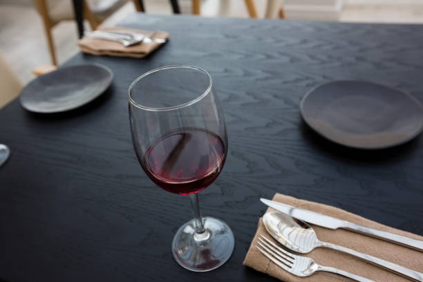 istock Red wine in glass on table at restaurant 846656836