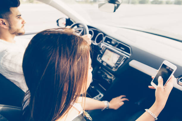 istock Young woman co-pilot using a mobile phone in a car 846657496
