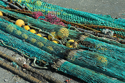 Fishing nets in the port of Loctudy, Finistere, Brittany, France spread to dry