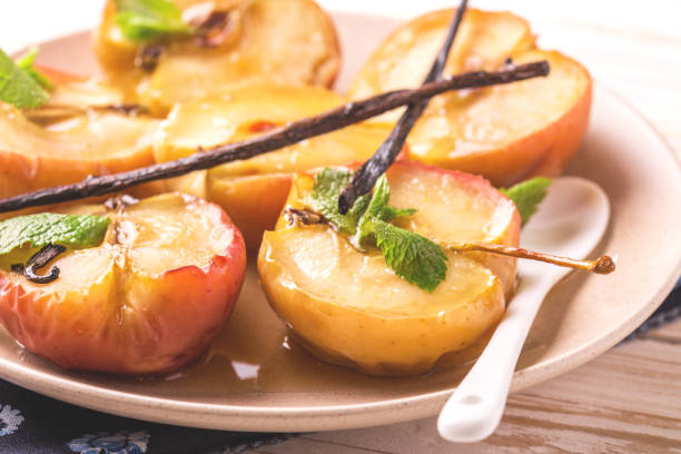 istock Baked red apples with vanilla syrop, mint and honey 846665290