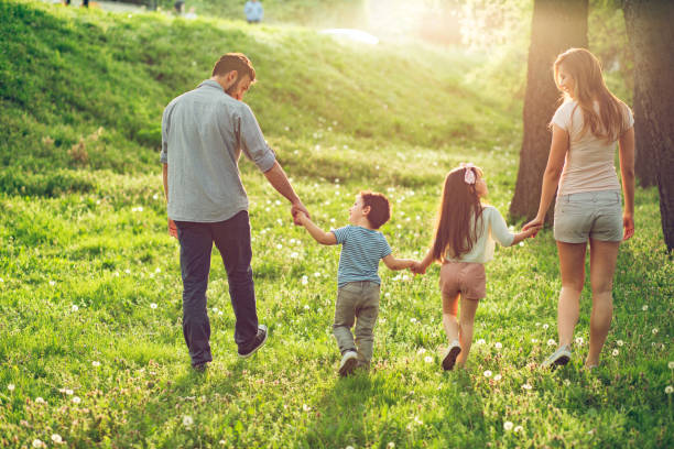 istock Happy family enjoying their spring day walk in nature 846668228