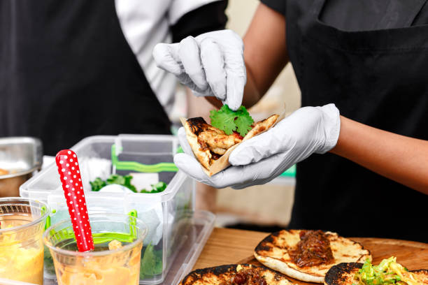istock Street vendor hands making taco outdoors 846670912