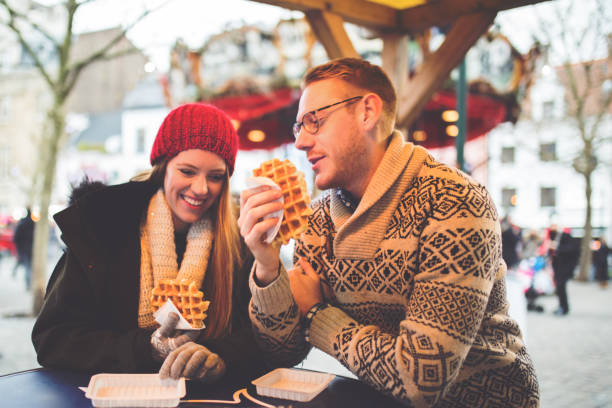 enjoy eating waffles - brussels waffle belgian waffle people imagens e fotografias de stock