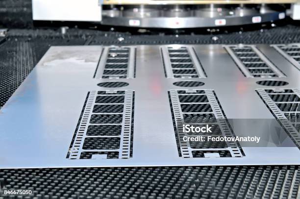 Metal Sheet With Details Cuttings From It Stock Photo - Download Image Now - Stainless Steel, Accuracy, Aluminum