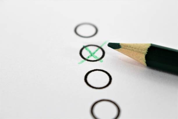 istock An concept Image of a green pencil and a questionnaire 846675404