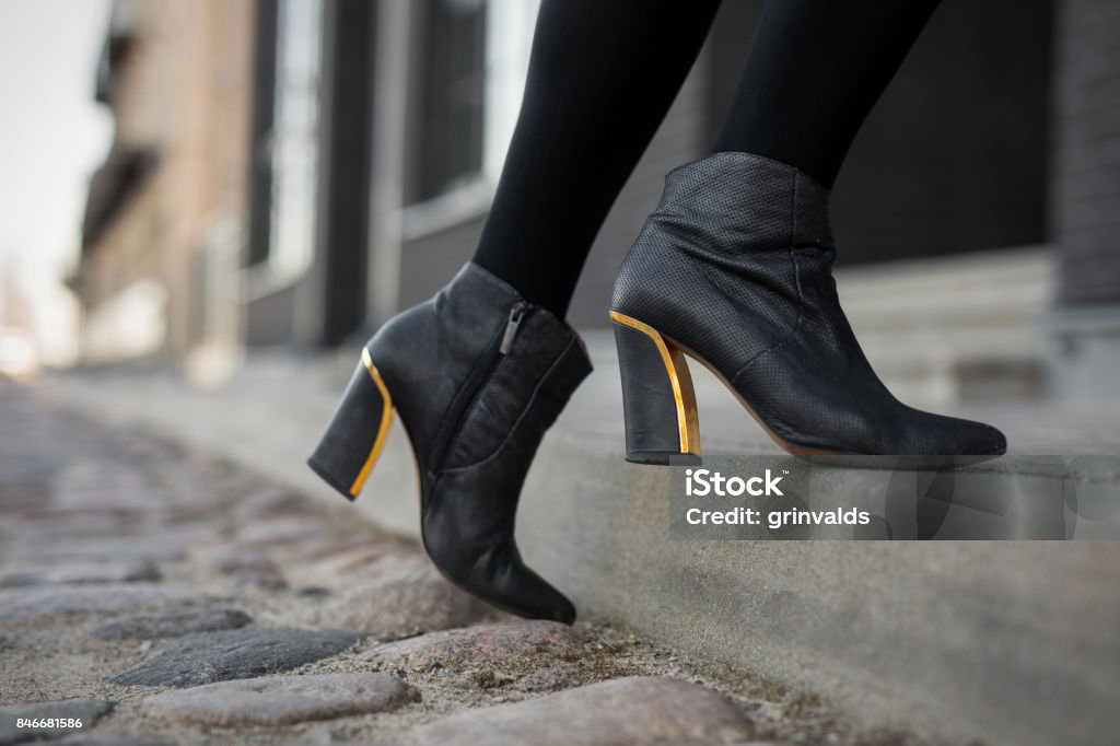 High heel boots High heel boots in city Shoe Stock Photo