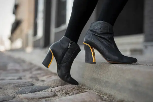 High heel boots in city