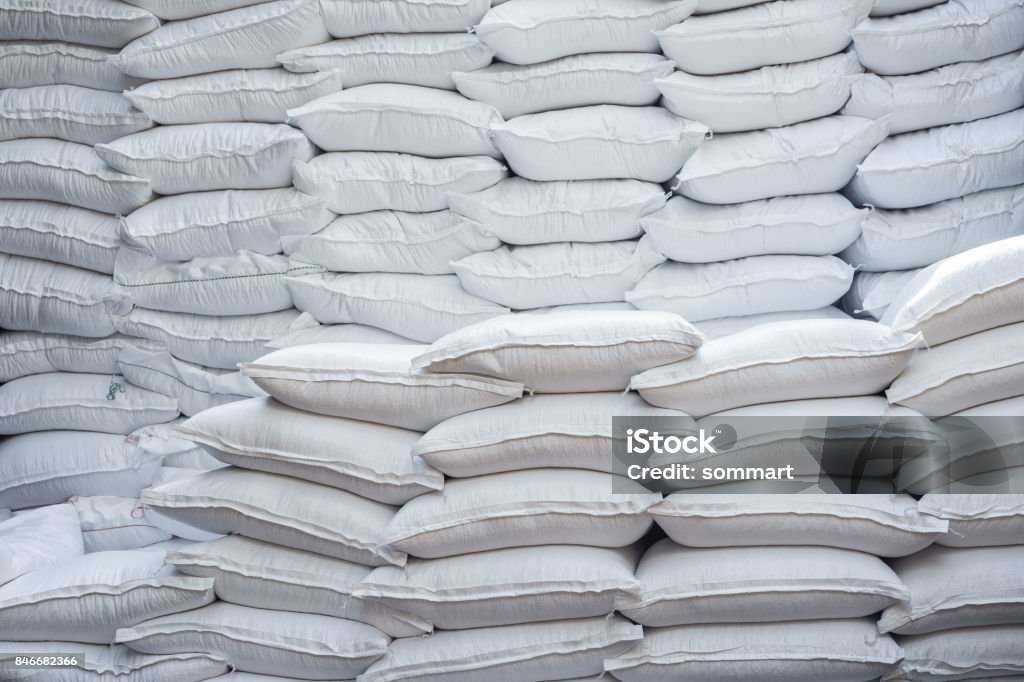 Stacking of wheat bags on truck move to warehouse. Bag Stock Photo