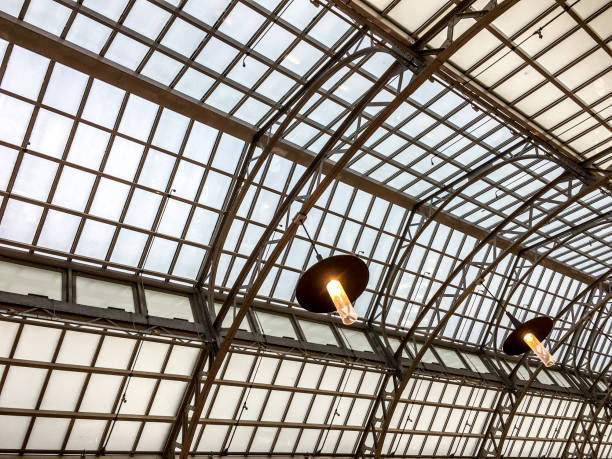 istock Metallic framework arch roof perspective at train station 846685566