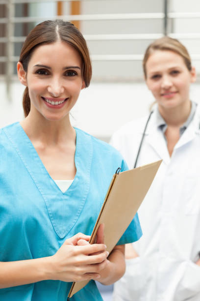 istock Nurse standing in a hospital reception with a doctor 846692810