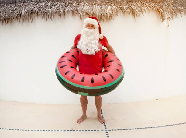 istock Santa Claus relaxing at the pool 846693916