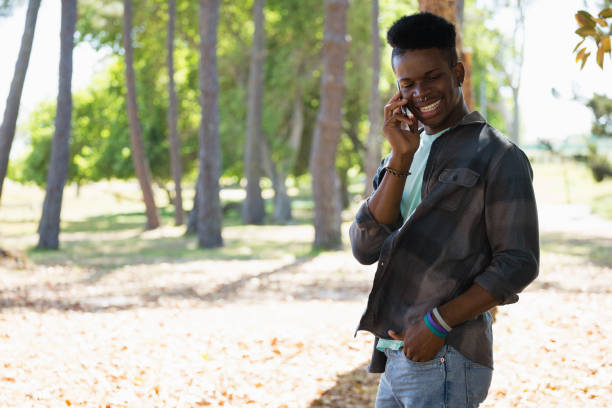 istock Man talking on mobile phone in the park 846696104