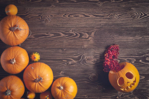 istock Halloween pumpkins over wooden background 846696248