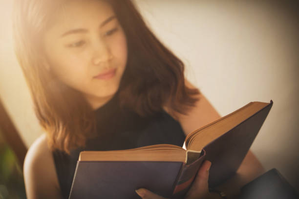 istock Asian woman reading a book vintage style. 846700036