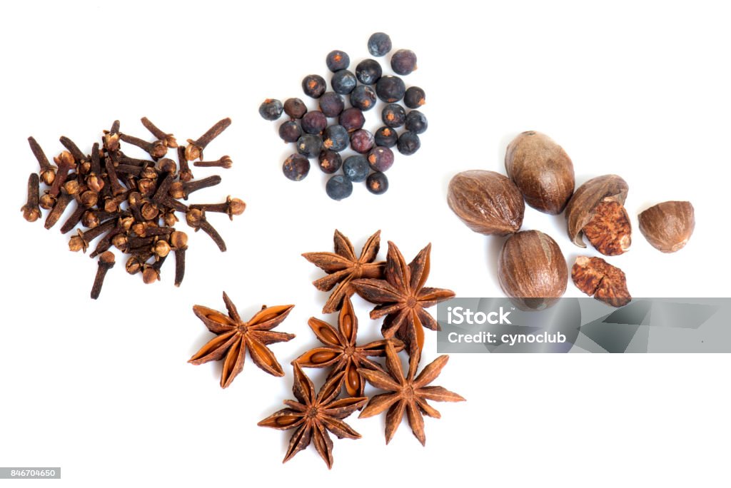 four spices four spices in front of white background Berry Stock Photo