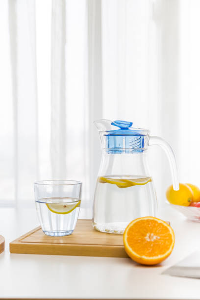 istock water with fruit, lemon and ice，near the window，bread 846704818