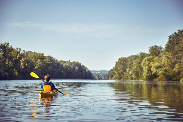 istock A canoe trip along the river along the forest in summer. 846708262