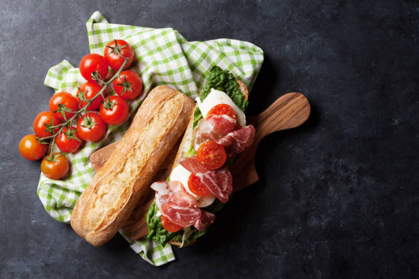 istock Sandwich with salad, prosciutto and mozzarella 846710554