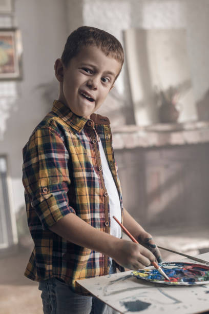 istock Young boy goofing around in an atelier 846711390