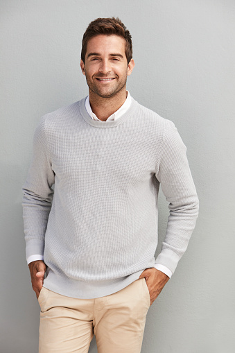 Smiling handsome dude in grey sweater, portrait