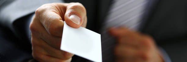 istock Male arm in suit give blank calling card to visitor 846719614
