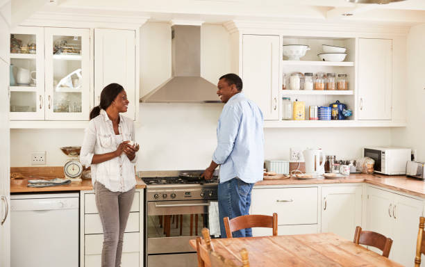 istock Mature Couple Chat In Kitchen As Husband Prepares Breakfast 846723630