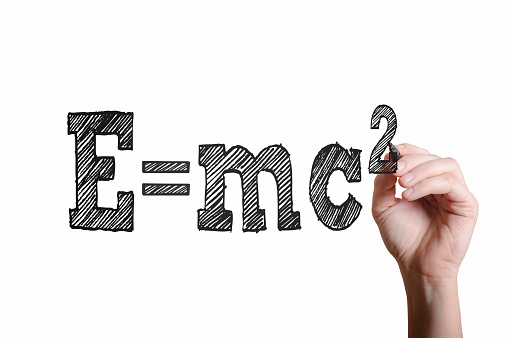 E=mc2. EMC2 written on virtual screen by science teacher or student in class.