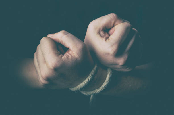 istock Man with tied hands in low key 846727400