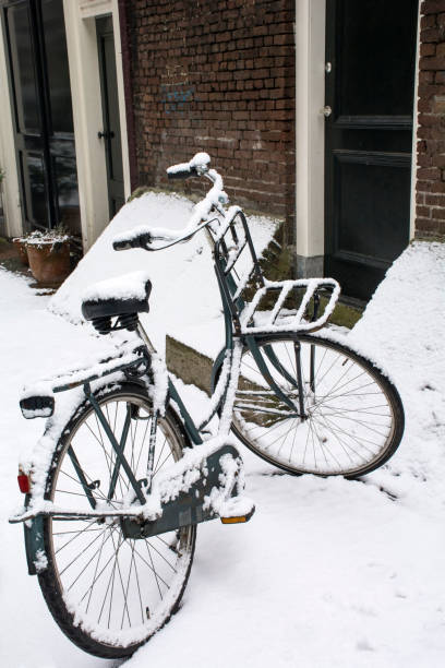 istock Black bike is on the ground in snow 846730554