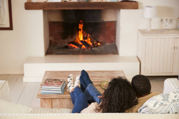 istock Romantic Couple Relaxing In Lounge Next To Open Fire 846735218