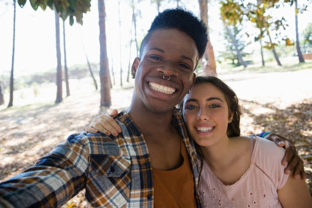 istock Couple posing together in the park 846736082