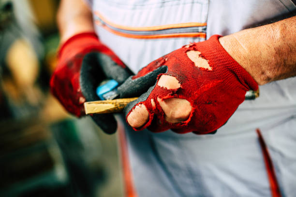 istock Senior man in workshop. Man divides wood. Close up. 846739850