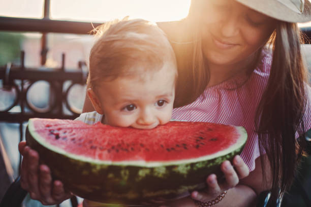 istock Adorable Baby Boy Biting Watermelon 846742282