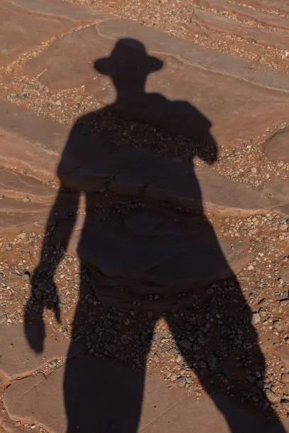 Shadow of a man in the hot desert