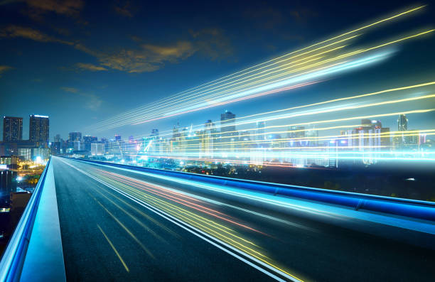 istock Empty asphalt flyover with city skyline and light trails ,night scene . 846746818