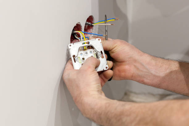 istock The hands of an electrician installing a wall power socket. 846749270
