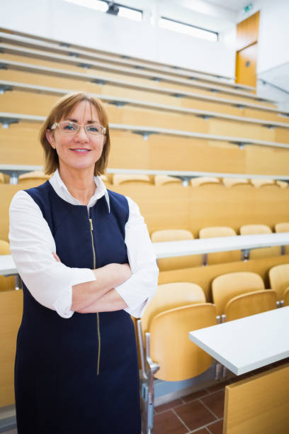 istock Elegant teacher standing in the lecture hall 846750564