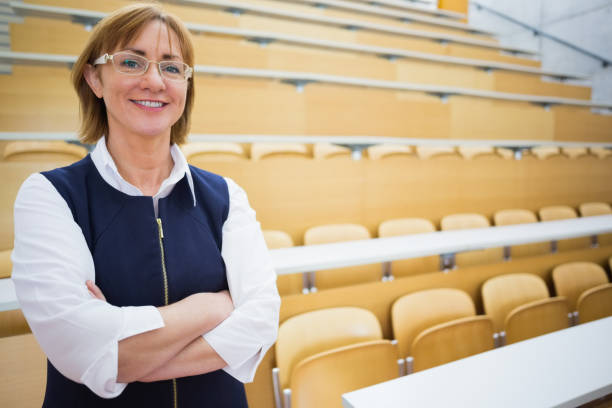 istock Elegant teacher standing in the lecture hall 846750580