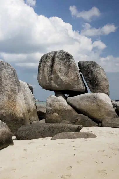 Natural rock formation on a white sand beach in Belitung Island in the afternoon, Indonesia.